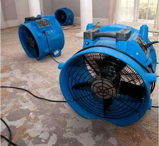 Water Damage Restoration - giant fans drying out a home with water damage